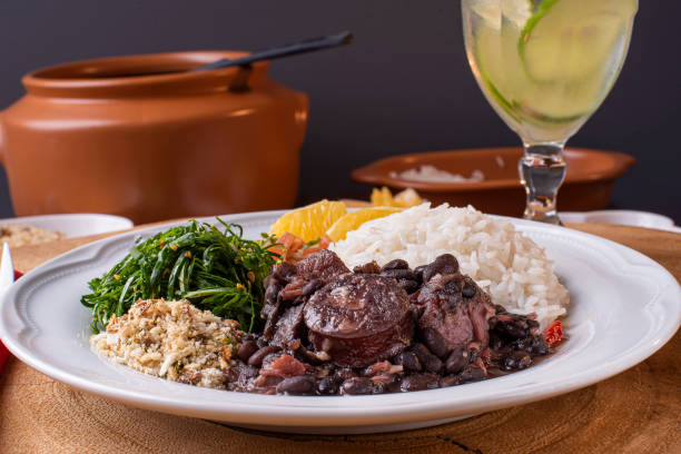Traditional Brazilian food called Feijoada. Black beans with pork