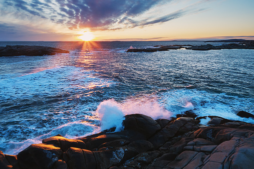 Low level drone view of sunset on the Atlantic coast of Nova Scotia.