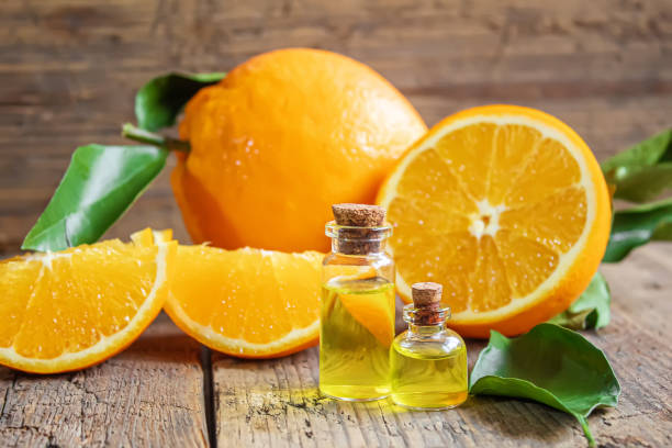 istock Essential aroma oil with citrus on wooden background. Selective focus. 1297820524