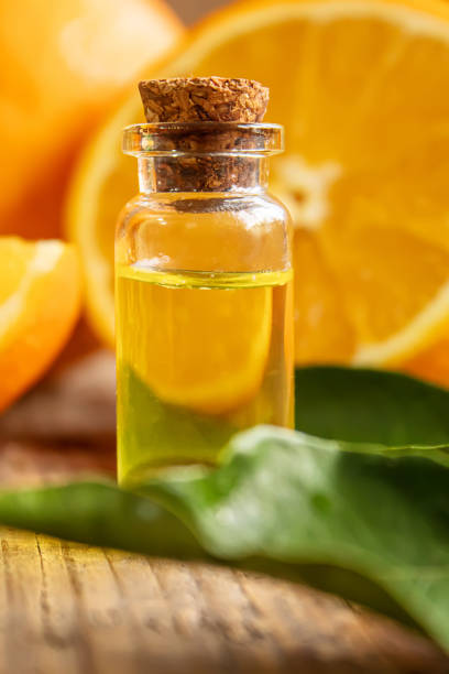 istock Essential aroma oil with citrus on wooden background. Selective focus. 1297820529
