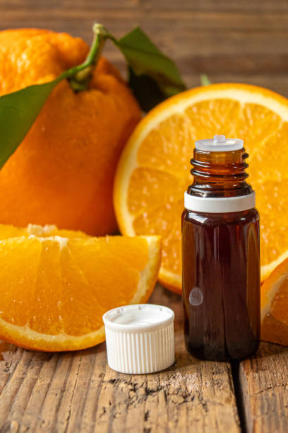 istock Essential aroma oil with citrus on wooden background. Selective focus. 1297820543