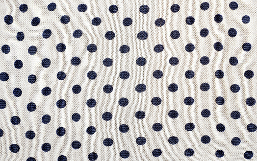 Knitted background, polka dots, abstract fashion background.