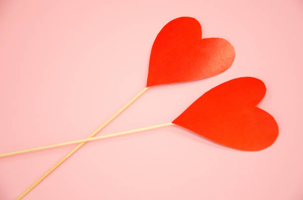 istock two hearts lie on a pink background. valentine's day concept 1297820638