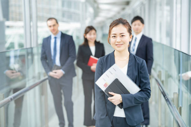 business woman and her business team - advertisement advertise businesswoman peeking imagens e fotografias de stock