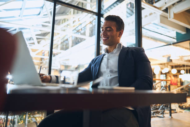 istock Cheerful elegant employee sitting at the laptop 1297821971