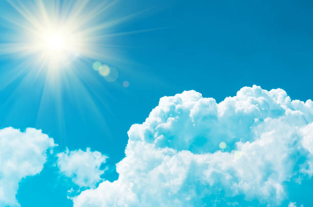 istock clouds in the blue sky and sun, natural background 1297823790