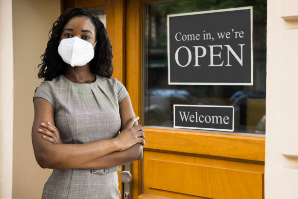istock Business Owner At Store Entrance 1297825694