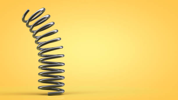 Dynamics of a metal spring. Yellow background. Copy space