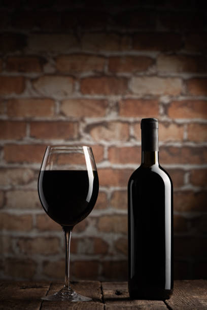 istock Red Wine Bottle with Glass 1297827796
