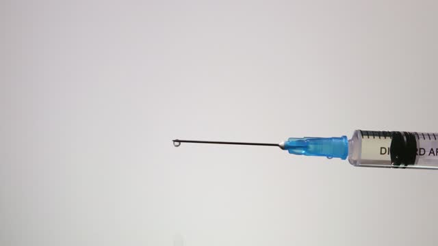 Drug is leaking from a syringe. Free Stock Video Footage Download Clips  medical research