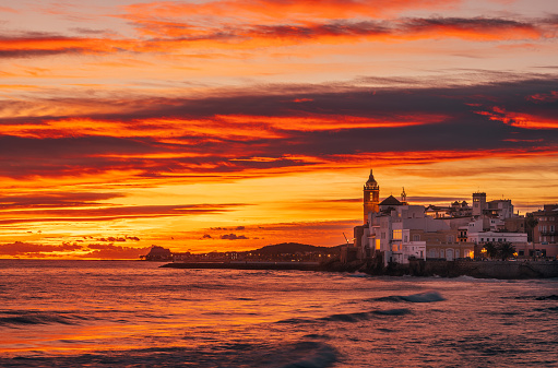 Sand beach and historical Old Town in mediterranean resort Sitges near Barcelona, Costa Dorada, Catalonia, Spain