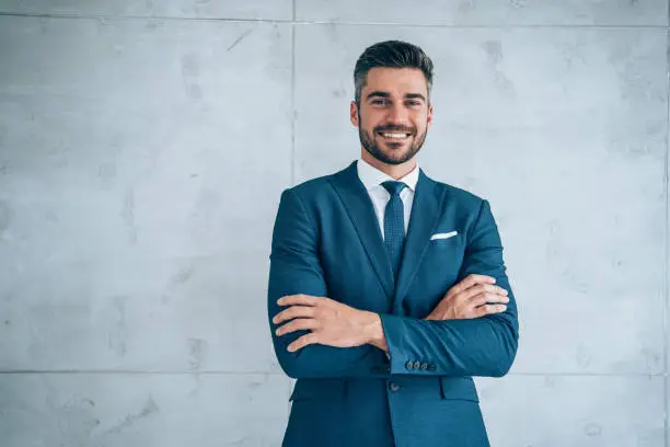 Photo of Portrait of a smiling young businessman.