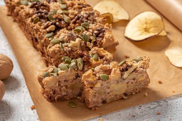 istock Gluten-free apple cake with walnuts, pumpkin seeds, cinnamon, and nutmeg 1297832813