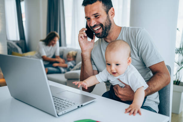 istock Father and baby working at home. 1297832845