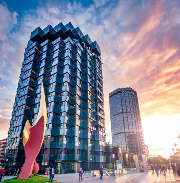 Barcelona, Spain - March 18, 2018: Skyscraper of La Caixa Headquarters complex on Avinguda Diagonal avenue at sunset in Barcelona