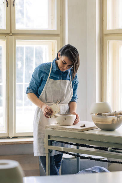istock Woman Artisan Making Ceramics 1297836510