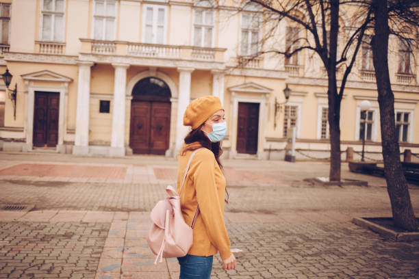 istock Young woman with a mask during pandemic 1297837158