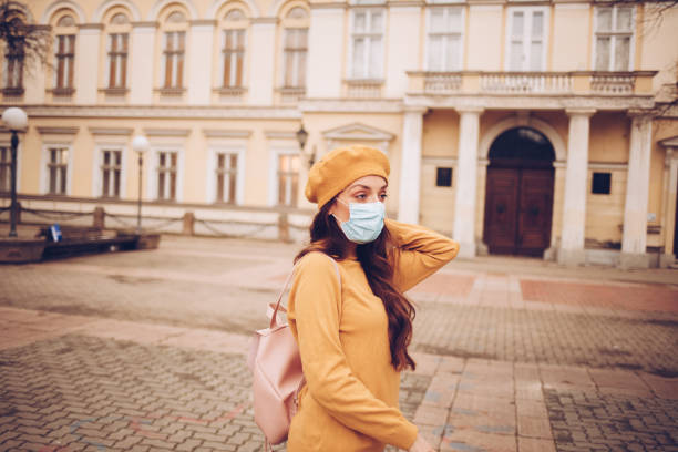 istock Young woman with a mask during pandemic 1297838055