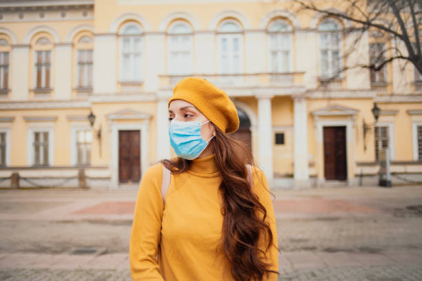 istock Young woman with a mask during pandemic 1297839855