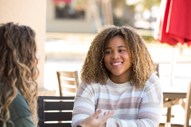 istock Two great friends enjoying an afternoon break at a sidewalk cafe. 1297841553