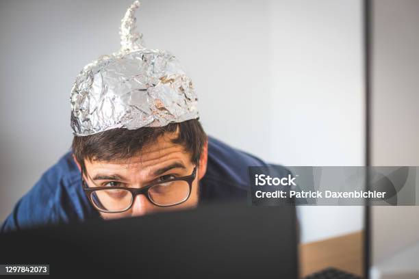 Conspiracy Theory Concept Young Man Is Wearing Aluminum Head Stock Photo - Download Image Now