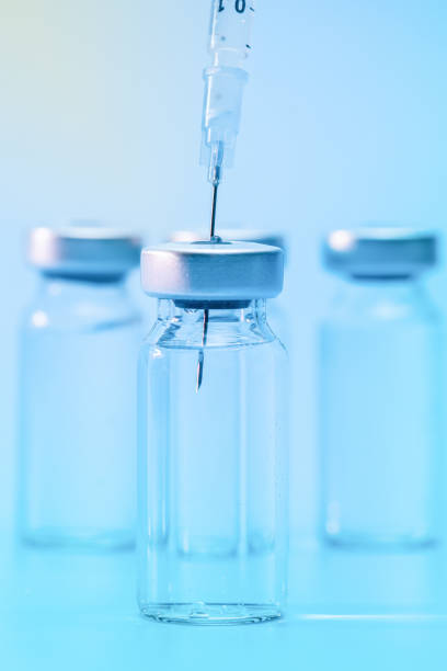 istock Vaccine vial with intramuscular needle 1297849179