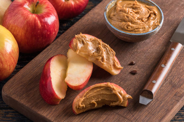 istock Peanut Butter on Apple Slices 1297849961