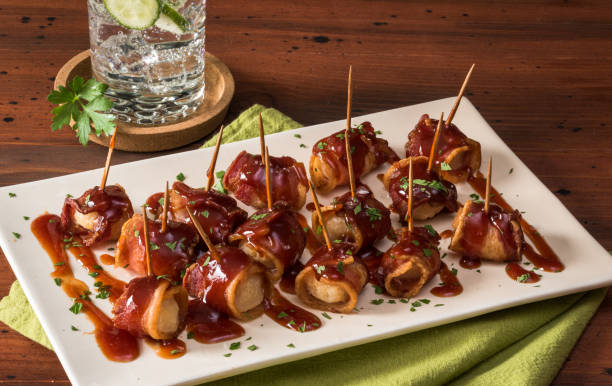 Bacon Wrapped Water Chestnuts Bacon Wrapped Water Chestnuts bacon wrapped stock pictures, royalty-free photos & images