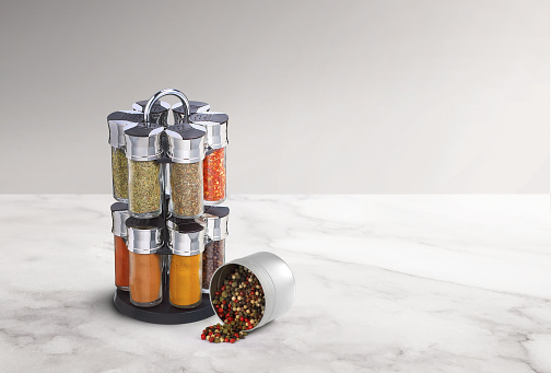 spice rack with bunch of different spices on it