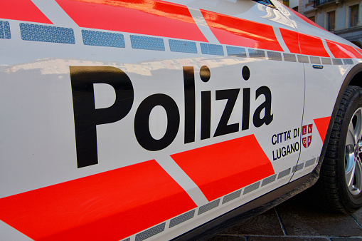Lugano, Ticino, Switzerland - 14th January 2021 : Close up of Polizia Città Lugano (Police city of Lugano) inscription on a car door