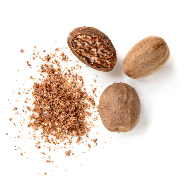 Nutmeg isolated.  Whole and grated, top view. Nutmeg isolated.  Whole and grated, top view. Nutmeg stock pictures, royalty-free photos & images