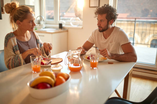 istock A young couple having a breakfast at home together. Relationship, love, together, breakfast 1297851871