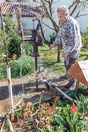 Senior Man Having  Own Irrigation System to Watering the Garden