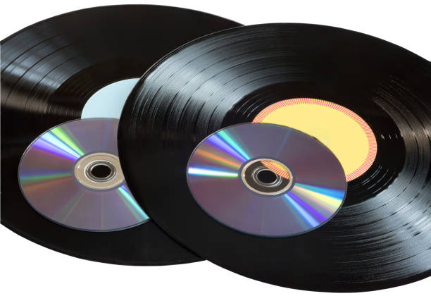 istock Vinyl records and CDs disks on a white background. 1297856000