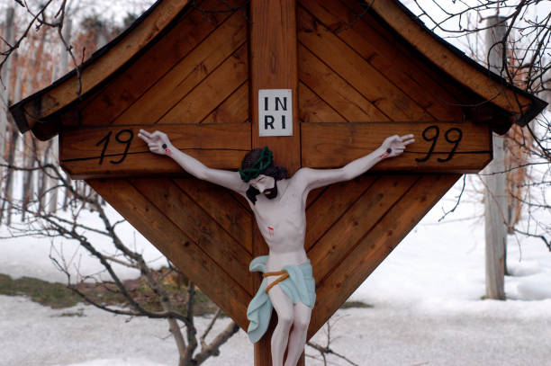 istock Jesus Christ hanging on cross 1297858321