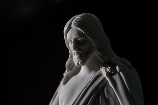 Close Up of Christus Statue With Dramatic Lighting