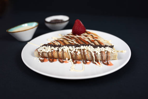 istock Beautiful crepe with chocolate spread and strawberries. 1297859423