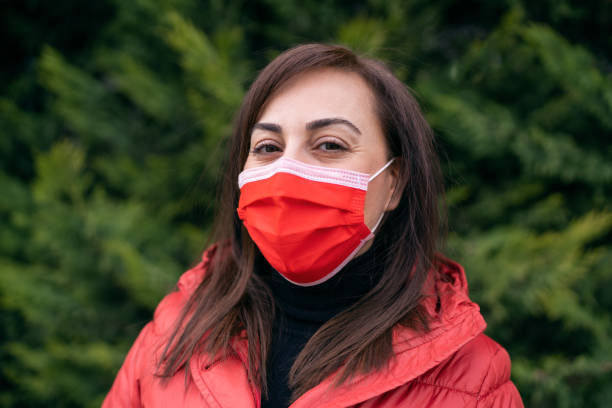 istock Young woman with protective mask on her face 1297860850
