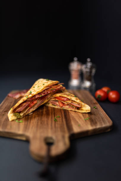 istock Crepes, thin pancakes with bacon, cheese,iceberg lettuce and tomato. 1297861370