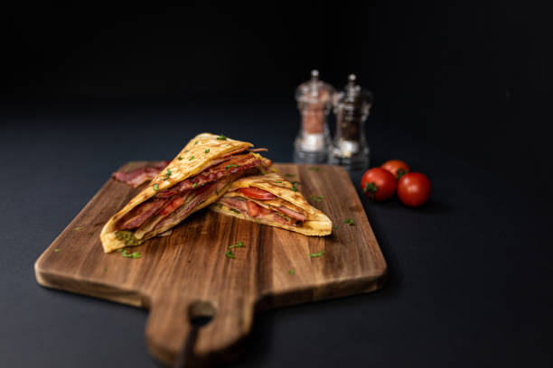 istock Crepes, thin pancakes with bacon, cheese,iceberg lettuce and tomato. 1297861401