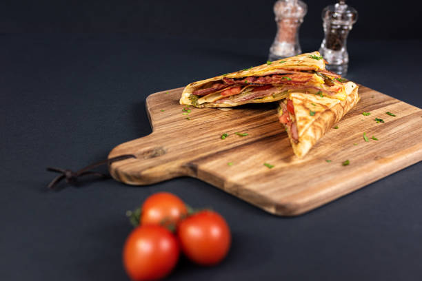 istock Crepes, thin pancakes with bacon, cheese,iceberg lettuce and tomato. 1297861415