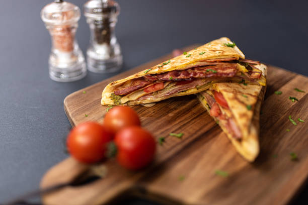 istock Crepes, thin pancakes with bacon, cheese,iceberg lettuce and tomato. 1297861421