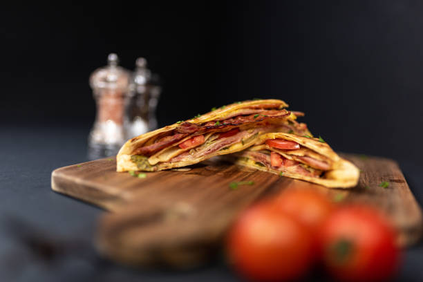 istock Crepes, thin pancakes with bacon, cheese,iceberg lettuce and tomato. 1297861429
