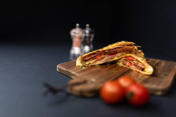 istock Crepes, thin pancakes with bacon, cheese,iceberg lettuce and tomato. 1297861446