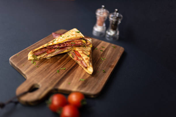 istock Crepes, thin pancakes with bacon, cheese,iceberg lettuce and tomato. 1297861459