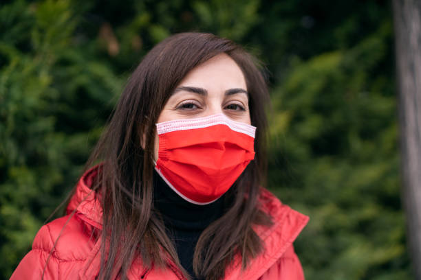istock Young woman with protective mask on her face 1297862416