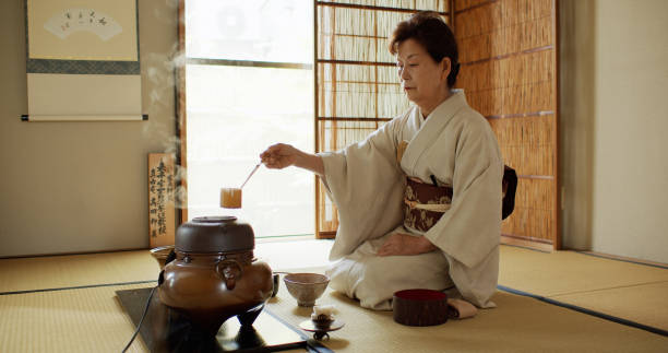 istock Tea Ceremony Host Measuring Water from Boiler 1297863287