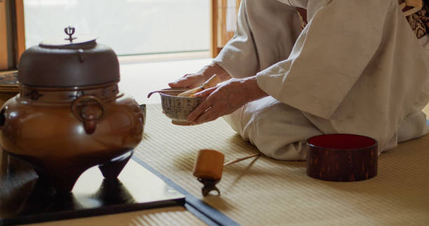 istock Hands of Tea Ceremony Hostess Holding Bowl 1297863303