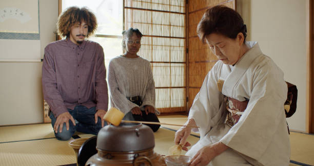 istock Attentive Guests at Japanese Tea Ceremony 1297863308