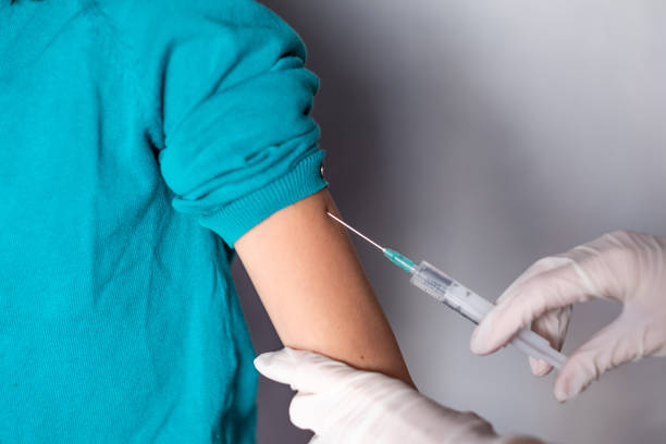 istock Close up child is receiving vaccine 1297863861